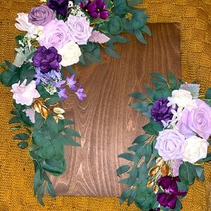 Assorted purple silk flower arrangements.
